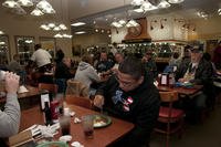 Veterans enjoy a free meal at Golden Corral, in Fort Wayne, Ind., on Veteran's Day, Nov. 9, 2013.