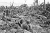 In their slow and hard-fought advance on Peleliu Island, the Marines take advantage of their first opportunity to dig foxholes in Palau.