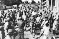 Allied soldiers, prisoners of the Japanese for more than three years, reach the 92nd Evacuation Hospital on Luzon Island, the Philippines, following their rescue from the enemy's prison camp at Cabanatuan by American Rangers and Filipino guerrillas, Feb. 9, 1945.