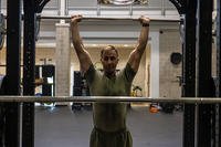 U.S. Marine Corps 1st Sgt. Edward Underwood executes a shoulder press during the human health and performance initiative on Camp Lejeune, North Carolina.