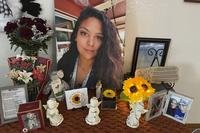 A photograph of Stephanie Cosme sits on an altar