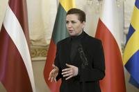 Denmark's Prime Minister Mette Frederiksen gives a statement