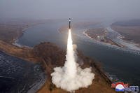 test fire of a new type intermediate-range hypersonic ballistic missile at an undisclosed place in North Korea