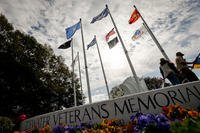 The sun illuminates the Tidewater Veterans Memorial during the Veterans Day Parade in Virginia Beach, Virginia