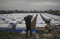 A boy looks over a newly established tent camp for displaced Palestinians.