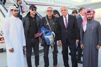 George Glezmann, center, poses with Adam Boehler, second left, and Zalmay Khalilzad, second right, and Qatari diplomats