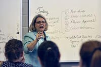 A university professor teaches a class.