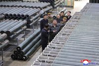 North Korean leader Kim Jong Un, center, visits a munitions factory in North Korea
