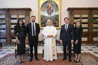 Pope Leo XIV stands for a family photo with Vice President JD Vance