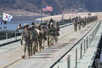 U.S. soldiers cross a river over a floating bridge during a joint river-crossing exercise between South Korea and the U.S. as part of the Freedom Shield 25 training in Yeoncheon, South Korea.