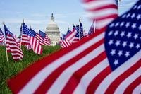 The U.S. Capitol is seen past American flags on the National Mall