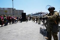 National Guard stand by as protesters gather to denounce ICE in Los Angeles