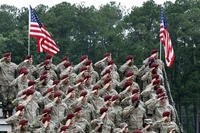 Soldiers of Fort Bragg salute during the playing of the national anthem