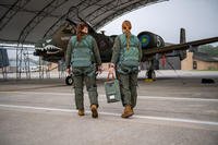 U.S. Air Force pilots assigned to the 74th Fighter Squadron carry an Airus bladder relief system