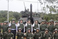 Taiwan President Lai Ching-te poses with soldiers in Hsinchu County, Taiwan
