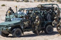 Soldiers fight in tandem with various robotics