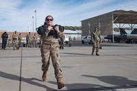 U.S. Air Force Tech. Sgt. Marcella Quinonez, an aircraft armament systems specialist from the 57th Maintenance Group, performs a sandbag front carry during the fitness portion of the 4th quarter weapons standardization team load crew competition at Nellis Air Force Base, Nevada.