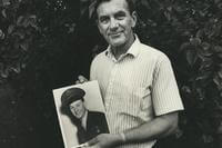 Ken Budd holds a photo of brother, Robert in 1989. The photo was taken shortly before Ken's 3rd trip to Guadalcanal to look for his brother's body. Robert was found in 2021, just a month after his brother's death.