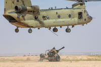 A U.S. Army CH-47 Chinook helicopter prepares to take off after a sling-load operation near Al Asad Air Base, Iraq.