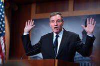 Sen. Mark Warner, D-Va., the top Democrat on the Senate Intelligence Committee, speaks about the Trump administration following reports that only Republican lawmakers received security briefings on the Trump-ordered military strikes against boats in the Caribbean, during a news conference at the Capitol in Washington, Thursday, Oct. 30, 2025. (AP Photo/J. Scott Applewhite)