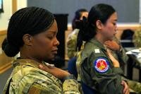 Two military officers in a breathing exercise.
