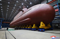 Kim Jong Un inspects a nuclear-powered submarine.