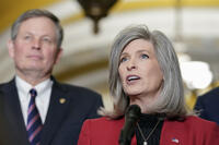 Sen. Joni Ernst, R-Iowa, right, speaks as Sen. Steve Daines, R-Mont., listens Wednesday, March 15, 2023, on Capitol Hill in Washington. (AP Photo/Mariam Zuhaib)