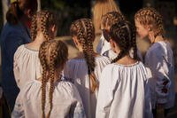 Children of an Ukrainian dance group prepare to perform during an event held to show solidarity with Ukraine, marking its upcoming Aug. 24 Independence Day, in Bucharest, Romania, Thursday, Aug. 21, 2025. (AP Photo/Andreea Alexandru)