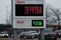 Gas prices are displayed at a gas station, in Buffalo Grove, Ill., Tuesday, March 3, 2026. (AP Photo/Nam Y. Huh)
