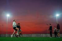 Airmen work out in the outdoors.