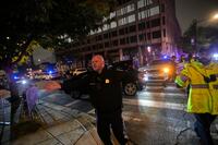 Law enforcement officials direct traffic outside the White House Correspondents Dinner.