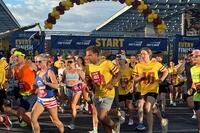 Runners take off at the start line of Pat's Run.