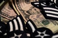 Air Force insignia patches mingling with cash bills.