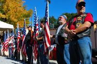 A group of motorcycle riders stand proudly during a ceremony honoring veterans at the Panama City Rescue Mission Nov. 11. The event provided free meals to homeless veterans. (Air Force Photo)