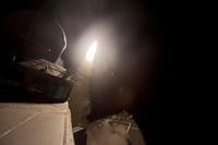 The guided missile destroyer USS Arleigh Burke (DDG 51) launches a Tomahawk cruise missile in the Red Sea Sept. 23, 2014. (U.S. Navy photo/Carlos M. Vazquez II)