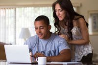 Couple looking at a laptop