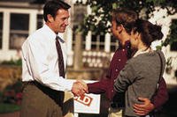 Couple closes deal on house