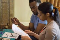 Couple reviewing credit records