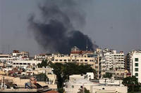 Black columns of smoke rise from heavy shelling in the Jobar neighborhood, east of Damascus, Syria.