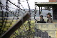 In this Sept. 17, 2014, file photo, South Korean soldiers stand guard at a military check point at the Imjingak Pavilion near the border village of Panmunjom. Ahn Young-joon/AP