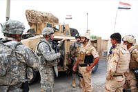 Sgt. 1st Class Allan Cottone talks to Iraqi Army Soldiers (U.S. Army photo by Spc. William A. Joeckel, 2nd AAB, 1st Inf. Div., USD-C)