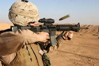 Sergeant Christopher L. McCabe fires his rifle during monthly range training (Marines/Corporal Thomas J. Griffith)