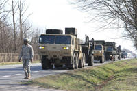 A column of military vehicles carrying a Patriot missile system, from Delta Battery, 5th Battalion, 7th Air Defense Artillery Regiment, arrives for a training exercise at Sochaczew, Poland, March 18, 2015. (U.S. Army photo: Sgt. 1st Class Randall Jackson)