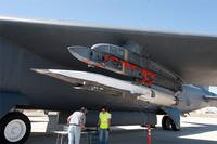 Ground crew members make the final checks to the X-51A Waverider scramjet-powered hypersonic flight demonstrator, which is affixed to an Edwards Air Force Base B-52H Stratofortress. (Photo by Bob Ferguson/Boeing)