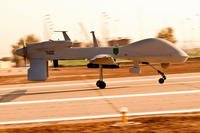 An MQ-1C Gray Eagle unmanned aircraft makes its way down an airfield at Camp Taji, Iraq, before a surveillance mission in the Baghdad area, in this undated file photo. (U.S. Army photo)