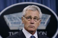 Defense Secretary Chuck Hagel listens during a news conference at the Pentagon, Monday, Feb. 24, 2014. (AP Photo/Carolyn Kaster)