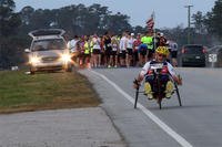 Paul Kelly, avid hand-cyclist, takes off from the starting line of the15th Annual Marine Corps Air Station Cherry Point Half Marathon March 22, 2014.