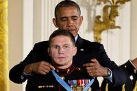 President Barack Obama awards retired Marine Cpl. William &quot;Kyle&quot; Carpenter, the Medal of Honor for conspicuous gallantry, Thursday, June 19, 2014, during a ceremony in the East Room of the White House in Washington. (AP Photo/Jacquelyn Martin)