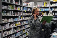 Capt. Christine Cox, 21st Medical Squadron pharmacist and support flight commander, reviews her notes at Schriever Air Force Base, Colorado (U.S. Air Force photo/Staff Sgt. Julius Delos Reyes)
