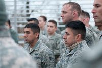 Fraternal twins Air Force Tech. Sgt. Matthew Renteria and Air Force Senior Airman Michael Pineda listen to a briefing at the Texas Military Forces Best Warrior Competition, Feb. 5, 2015. U.S. Army photo by Spc. Michael Giles